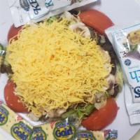 Steak Salad · Lettuce, topped with sauteed steak, onions, mushrooms and cheddar cheese.