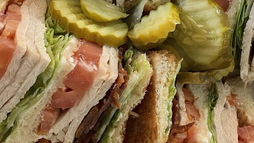 Club Sandwich · With turkey or ham, bacon, lettuce, tomatoes & mayo .