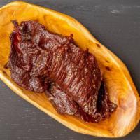 Bella'S Fried Beef Jerky · Laotian  Style Beef Jerky Thinly-sliced of beef soaked marinade, dehydrated and flashed frie...