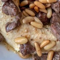 Hommous With Meat · Tender pieces of meat sautéed with our dressing and almonds.