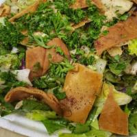 Fattoush · Fresh romaine lettuce with tomatoes and cucumbers mixed with toasted pita bread and house dr...