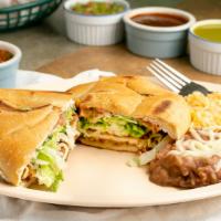 Torta · Served with Refried Beans, Lettuce, Onions, Tomatoes, Avocado, Cheese and Mayonnaise