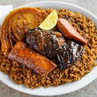 Thiebu Djeun · Fried rice (fresh tomato base or tomato paste base) served with vegetables and fish stew. Th...