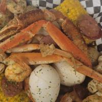 Combo 1 Seafood · Crab cluster, shrimp, corn, egg, sausage, and potatoes.