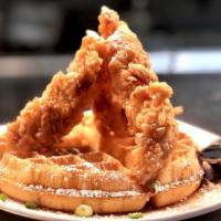 Chicken & Waffles (Large) · Crispy chicken tenders atop a Belgian waffle with scallions, chipotle maple syrup, and duste...