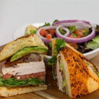 Tuscan Turkey Club · Roasted turkey, applewood bacon, caramelized onions, avocado, swiss cheese, lettuce, tomatoe...