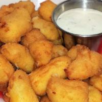 Wisconsin White Cheddar Cheese Curds · Aged white cheddar curds, large curds, and lightly breaded. Served with ranch dipping sauce.