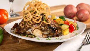 Bistro Meatloaf · Sliced and stacked with red-skin mashed potatoes, grilled onions, portobello mushrooms, bist...
