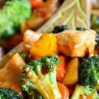 Chicken Stir Fry · Seasoned chicken breast sautéed with assorted vegetables, served over rice