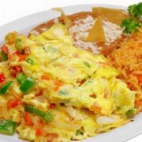 Huevos A La Mexicana · Three scrambled eggs with fresh jalapeño, onions and tomatoes. Served with tortillas, rice a...