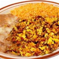 Huevos Con Chorizo · Served with rice, beans and tortillas.