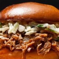 Pulled Pork · Gluten-free. Dry rubbed and smoked pulled pork shoulder topped with coleslaw.
