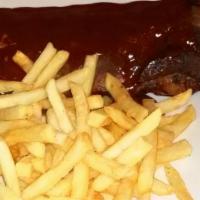 Baby Back Ribs · Pork rib from the loin side of the rib and choice of sauce.