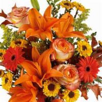 Burst Of Autumn · A burst of beauteous blooms in autumn shades of orange and yellow is mixed with a handful of...