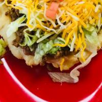 Sopes · Our version of a tostada made with our very own sopafelia dough. Topped with refried beans, ...