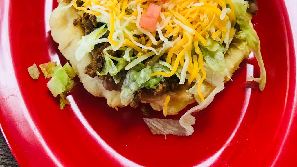 Sopes · Our version of a tostada made with our very own sopafelia dough. Topped with refried beans, protein, lettuce, cheese, tomato & a side of Jalapeno Ranch.