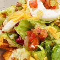 Taco Salad  · Choose Beef or Chicken comes in a fried tortilla shell lettuce, cheese, tomato, sour cream &...