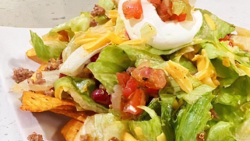 Taco Salad  · Choose Beef or Chicken comes in a fried tortilla shell lettuce, cheese, tomato, sour cream & salsa