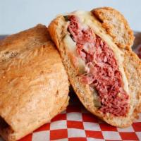 Uncle Billy · Warm shaved corned beef, Hook's baby swiss, sliced dill pickles, spicy brown mustard. Served...