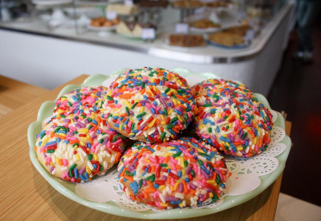 Sprinkle Spritz Cookie · Buttery, chewy, delicious and fun! A classic sugar cookie loaded with rainbow sprinkles.