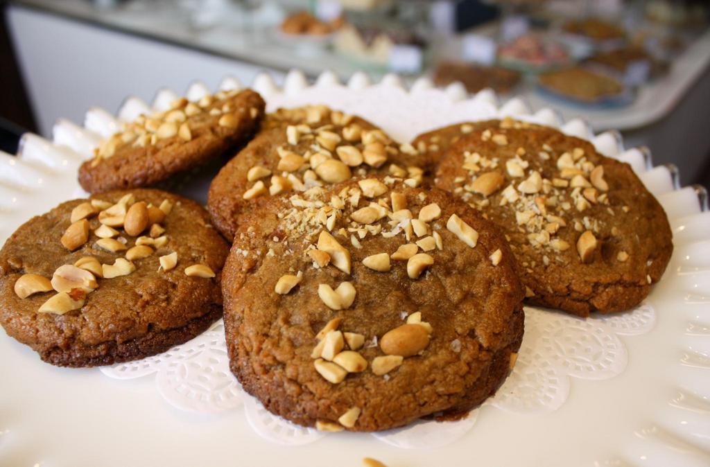 Chunky Peanut Butter Cookie (Gf) · Intensely peanut buttery and oh so chewy. Topped with roasted peanuts and flaky sea salt.   *Gluten-free*