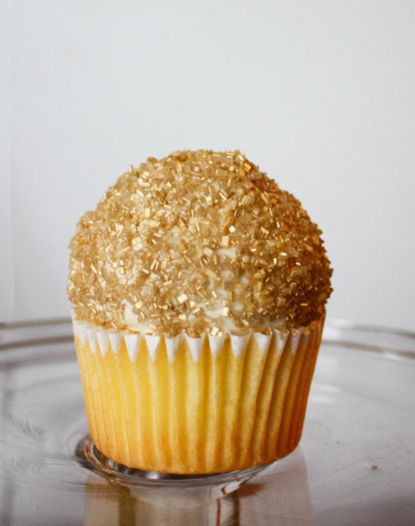 The King Pin Cupcake · Yellow cake, maple buttercream, gold sprinkles