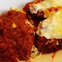 Eggplant Parmigiana · Hand breaded eggplant topped with our homemade marinara sauce and melted provolone parmigian...