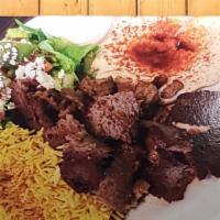 Gyro · Beef and lamb or chicken, rice, salad, tzatziki sauce, hummus, and pita bread.