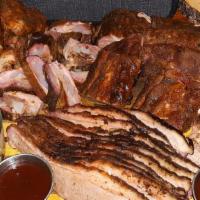 Family Meal Pack · Brisket, Pulled Pork, Ribs, Smoked chicken with brisket bean Potato salad and coleslaw & Bre...