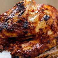 Whole Jerk Rotisserie Chicken Platter · comes with two large sides (Feeds four people)