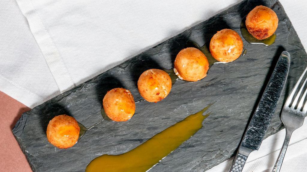 Croquetas De Queso De Cabra · Vegetarian. Goat cheese fritters with honey and balsamic reduction (chef’s favorite tapas).