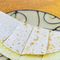 Cheese Quesadilla · 1/3rd lb of Mozzarella on a gourmet flour tortilla baked until it’s melty and delicious. Ser...