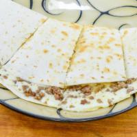 Ground Beef Quesadilla · 1/3rd lb of Mozzarella and ground beef on a gourmet flour tortilla baked until it’s melty an...