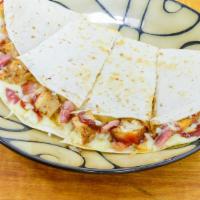 Bbq Chicken Quesadilla · 1/3rd lb of Mozzarella, grilled chicken, bacon, and onion on a gourmet flour tortilla baked ...