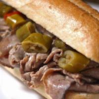 Italian Beef · Lean beef thinly sliced and stuffed into toasted French bread with au jus and hot peppers on...