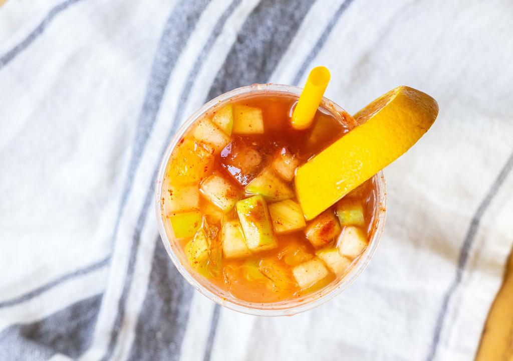 Tropirusa · Citrus soda with orange, apple and pineapple chunks with chamoy.