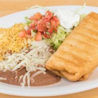 Chimichanga · 2 flour tortillas deep fried and filled with choice of beef tips or chicken, fried beans and...