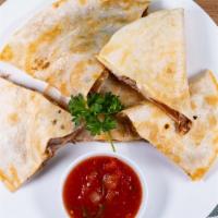 Quesadilla Rellena · 2 flour tortillas, grilled and stuffed with cheese, chopped beef or chicken. Served with gua...