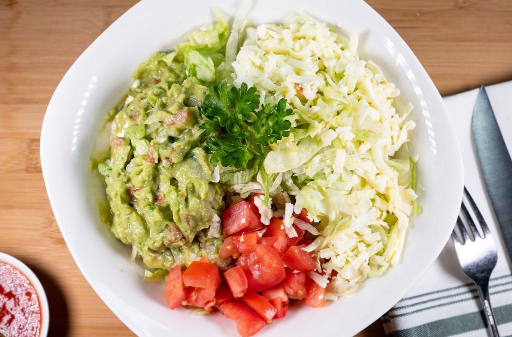 Guacamole Salad · Lettuce, tomatoes, guacamole and shredded cheese.