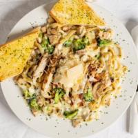 Chicken Saverio · Fettuccine alfredo with broccoli and mushrooms, topped with grilled chicken breast and melte...