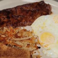 Steak & Eggs · 8oz. sirloin steak cooked to your liking. Served  two eggs, your choice of hash browns or gr...