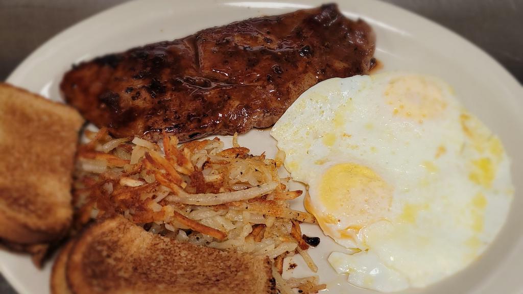 Steak & Eggs · 8oz. sirloin steak cooked to your liking. Served  two eggs, your choice of hash browns or grits and toast.