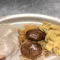 Big Country · One biscuit topped with sausage gravy, two eggs, hash browns and two sausage patties.