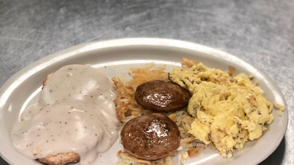 Big Country · One biscuit topped with sausage gravy, two eggs, hash browns and two sausage patties.