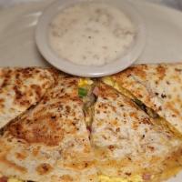 Breakfast Quesadilla · Scrambled eggs, with ham, bacon, ground sausage, green peppers, onions and shredded cheese i...