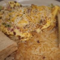 Meat Lover'S · 3 eggs with bacon,ham, sausage, green peppers, onions and topped with shredded cheese.