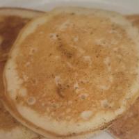 (3) Pancakes · 3 golden brown pancakes served with syrup.