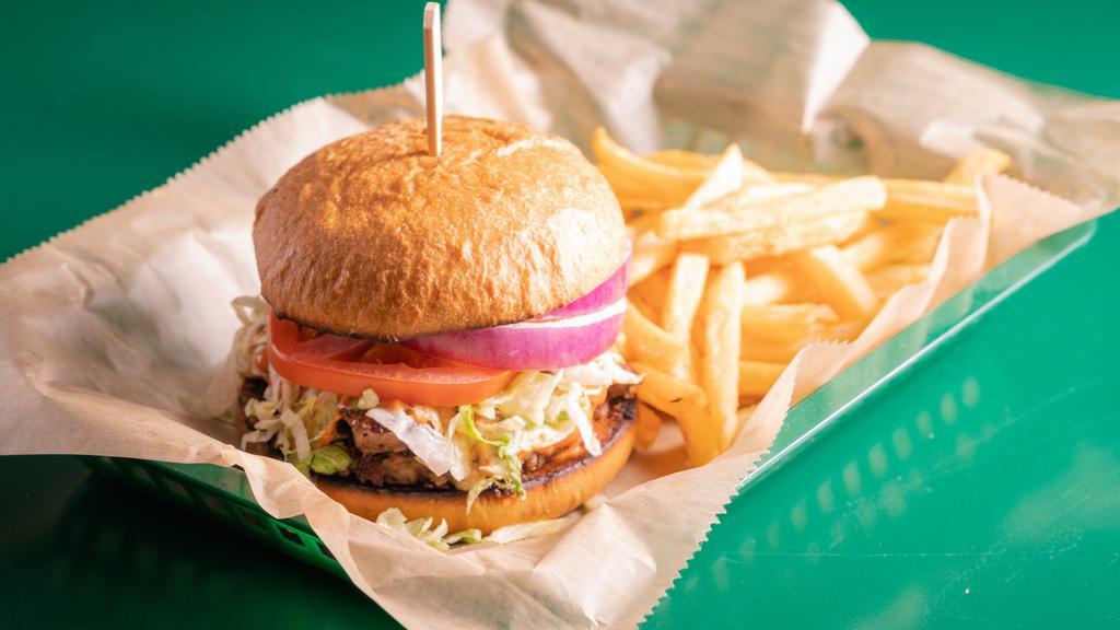 Shamrock Club Burger · Two smashed burger patties of seasoned ground beef with shredded lettuce, tomato, onion, pickles, and shamrock club sauce. Add cheese for an additional cost. Comes with fries. Or sub an impossible burger patty to make it vegetarian.