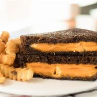 Grilled Cheese · Several slabs of American cheese, griddle-melted to a bubbling creaminess on your choice of ...