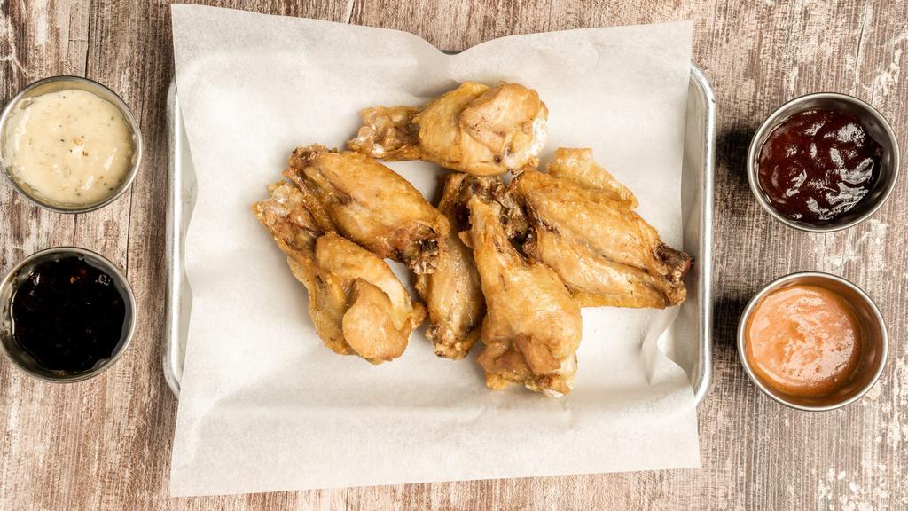 Wings · Sauces includes hot, Korean, spicy honey BBQ and garlic parmesan.